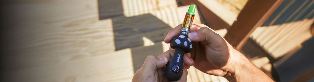 Woman holding Exxus Snap VV Pro in front of park trail