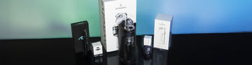 Wholesale Dr. Dabber Products standing on a black tablle with white and black marble textured wall inside studio