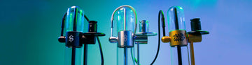Wholesale Stundenglass Gravity Infusers standing in studio using green and blue lighting