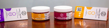 Wholesale High Hemp Delta 8 gummies and Delta 8 Disposables standing on office desk in normal lighting against the wall